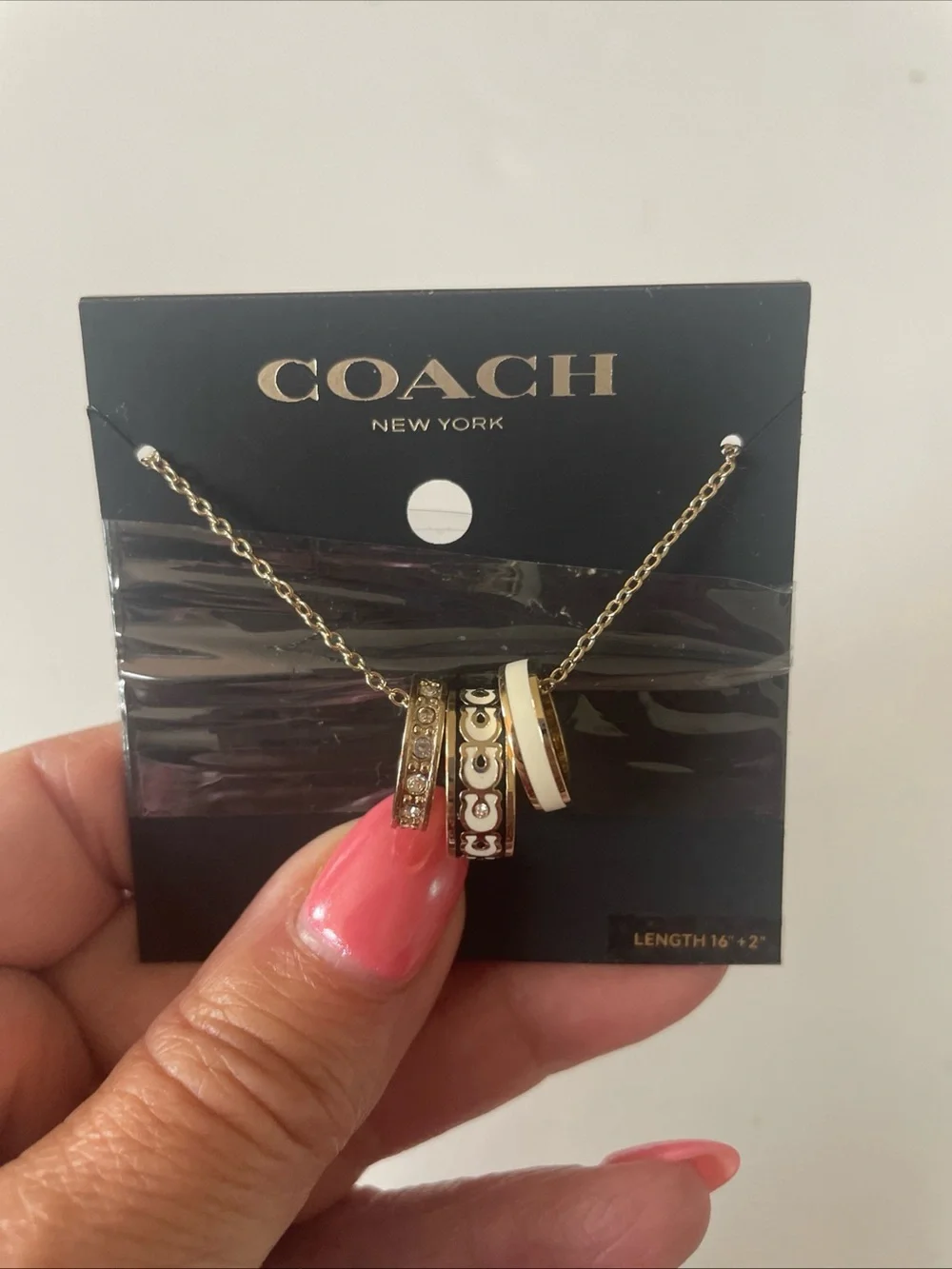 Coach Gold-Tone Necklace with White Enamel and Crystal-Accented Rings